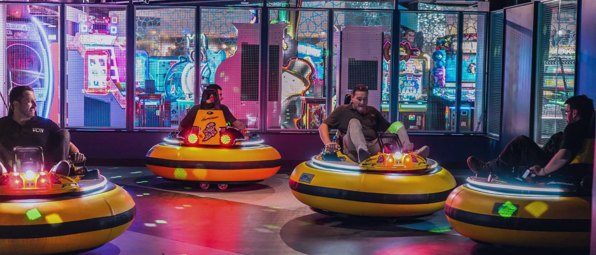 People playing on the yellow bumper cars at Star Pins Coventry