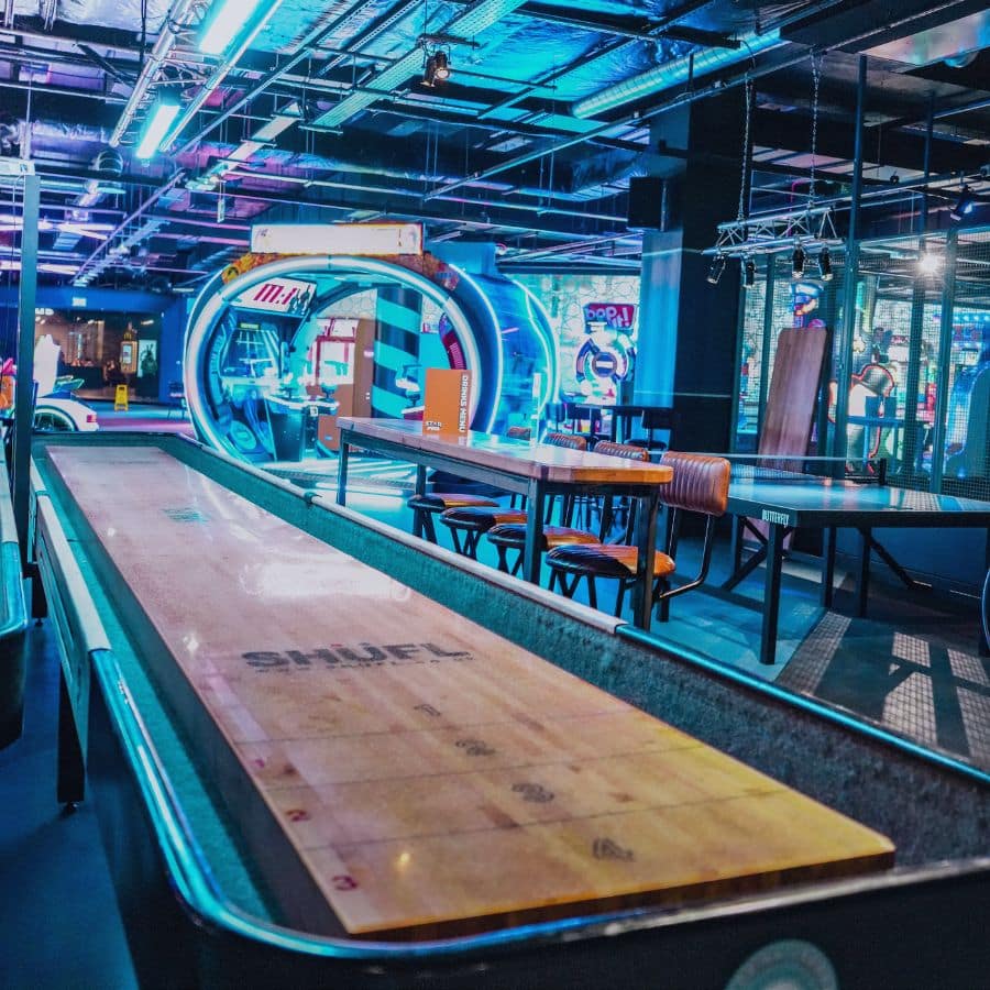 Shuffleboard in the foreground and arcade in the background