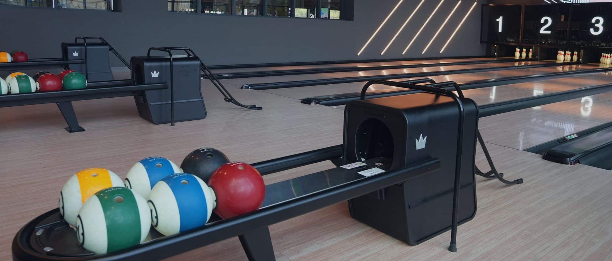 Brunswick bowling lanes and ball returns at The Pin.