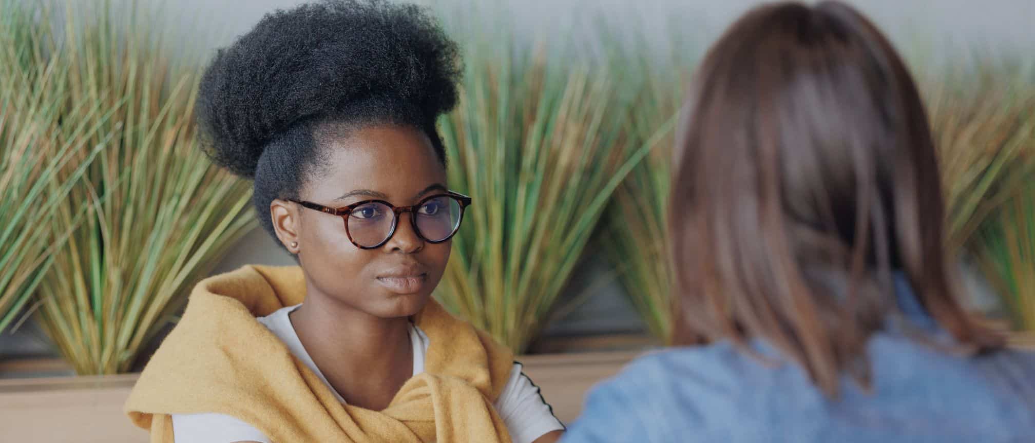 Well being meeting. Two women talking.