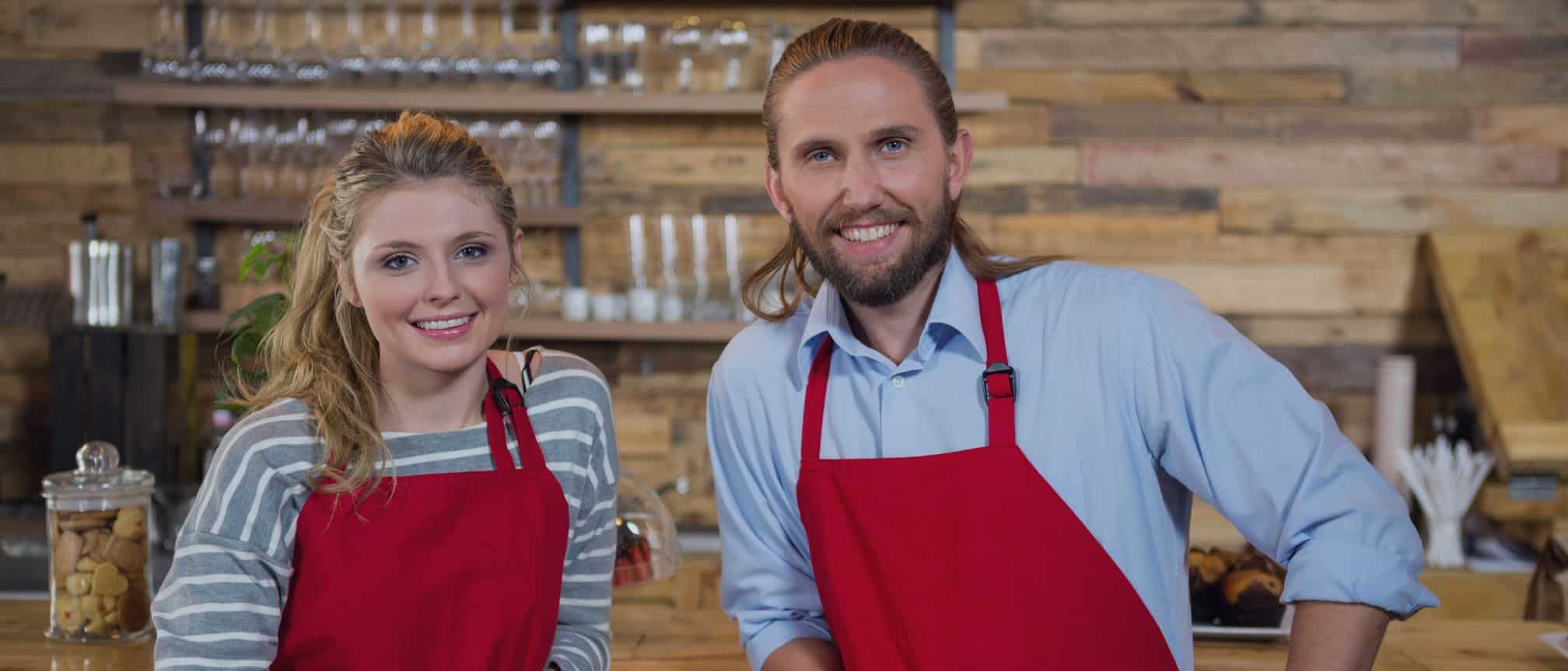 Picture of two happy baristas - well-being