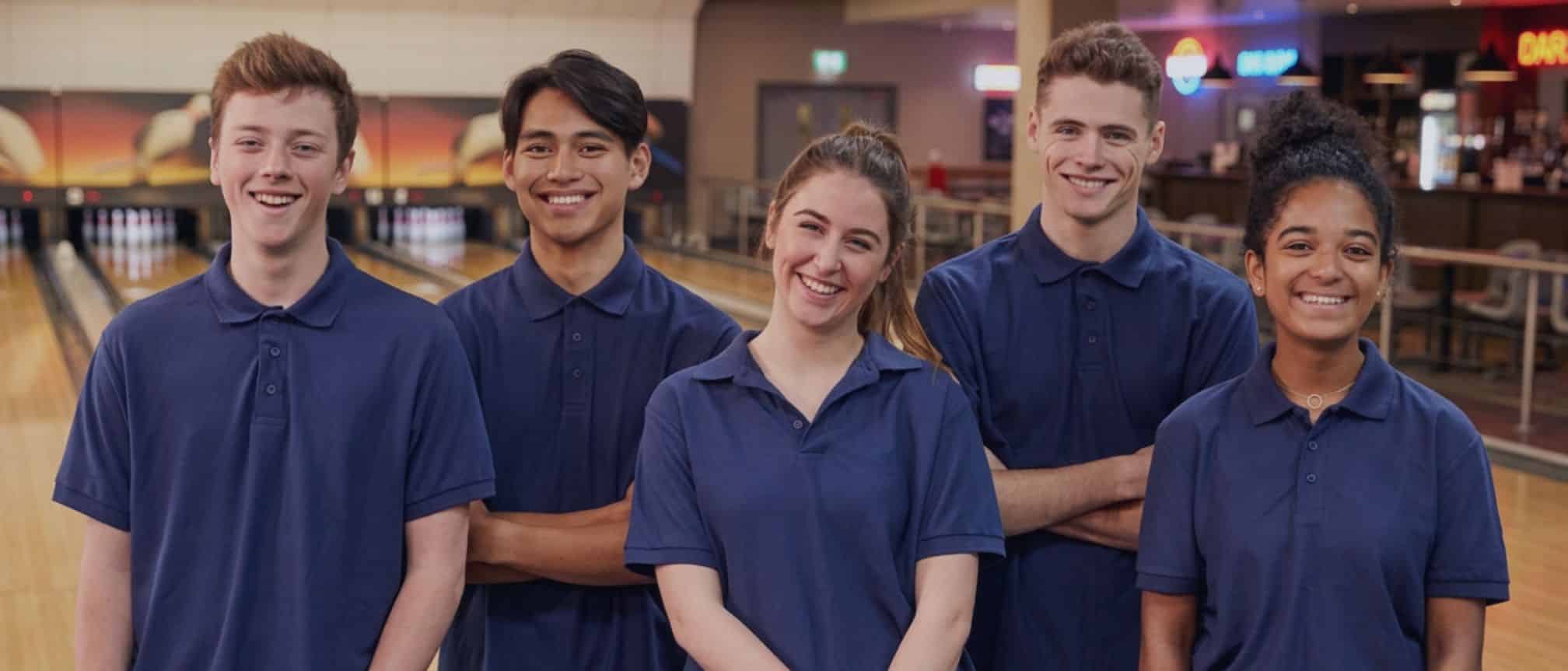 A team of 5 staff at a bowling centre